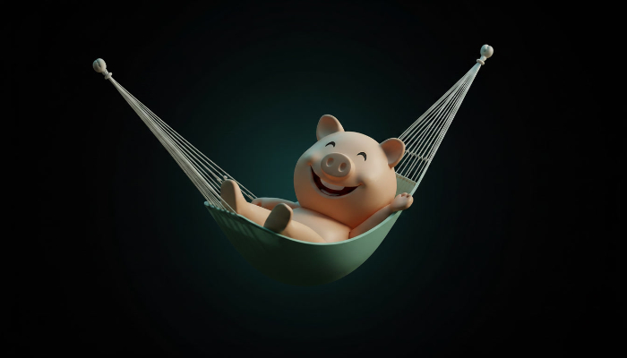 Happy piggy bank in a hammock representing low-stress website planning.